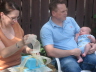 2007 07 15 Late in May of this year, Sara's cousin Rob and his wife Donna had their first child Wade.  We were lucky enough to be home for the baby shower.  Here, Rob and Donna Open Our Gifty.