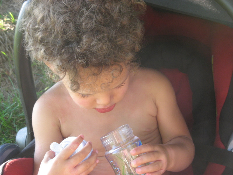 2007 07 22 Ruby makes a grass bottle for Harper
